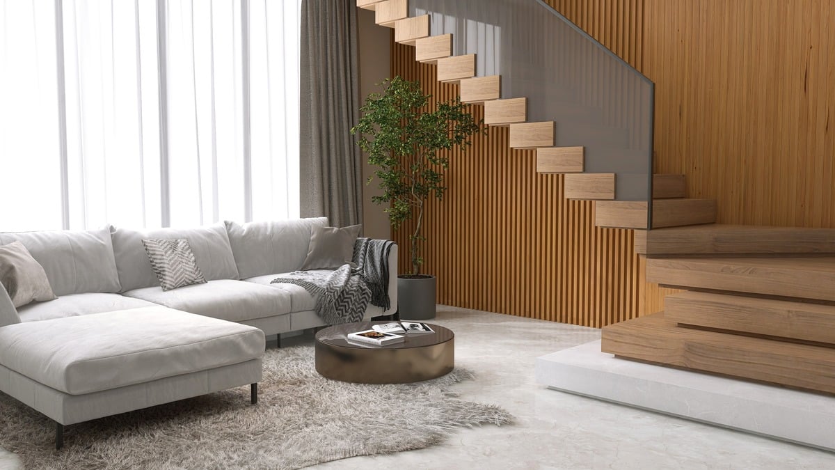 grey corner sofa in a luxury living room with wood panelled walls