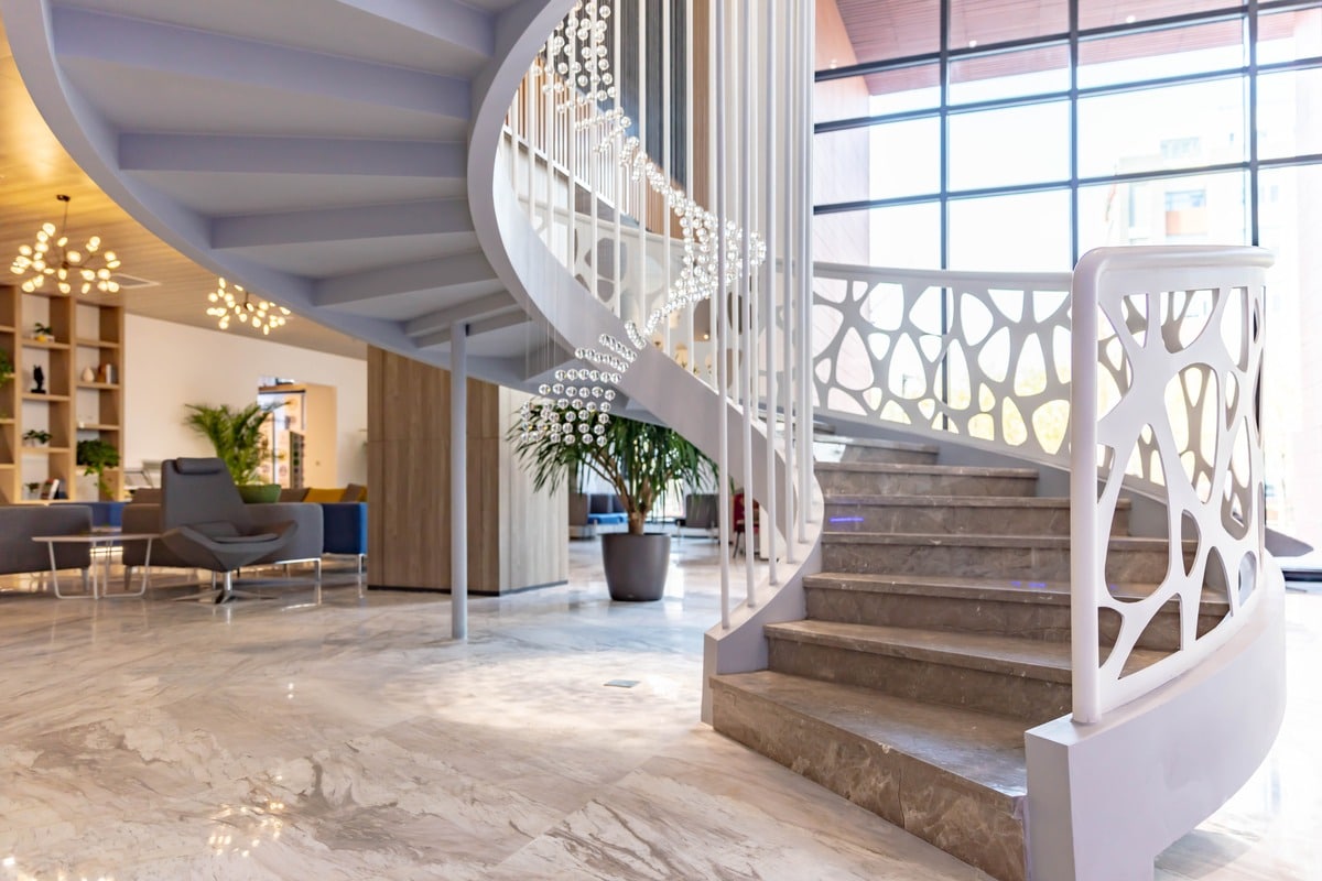 Interior of modern building lobby with spiral staircase