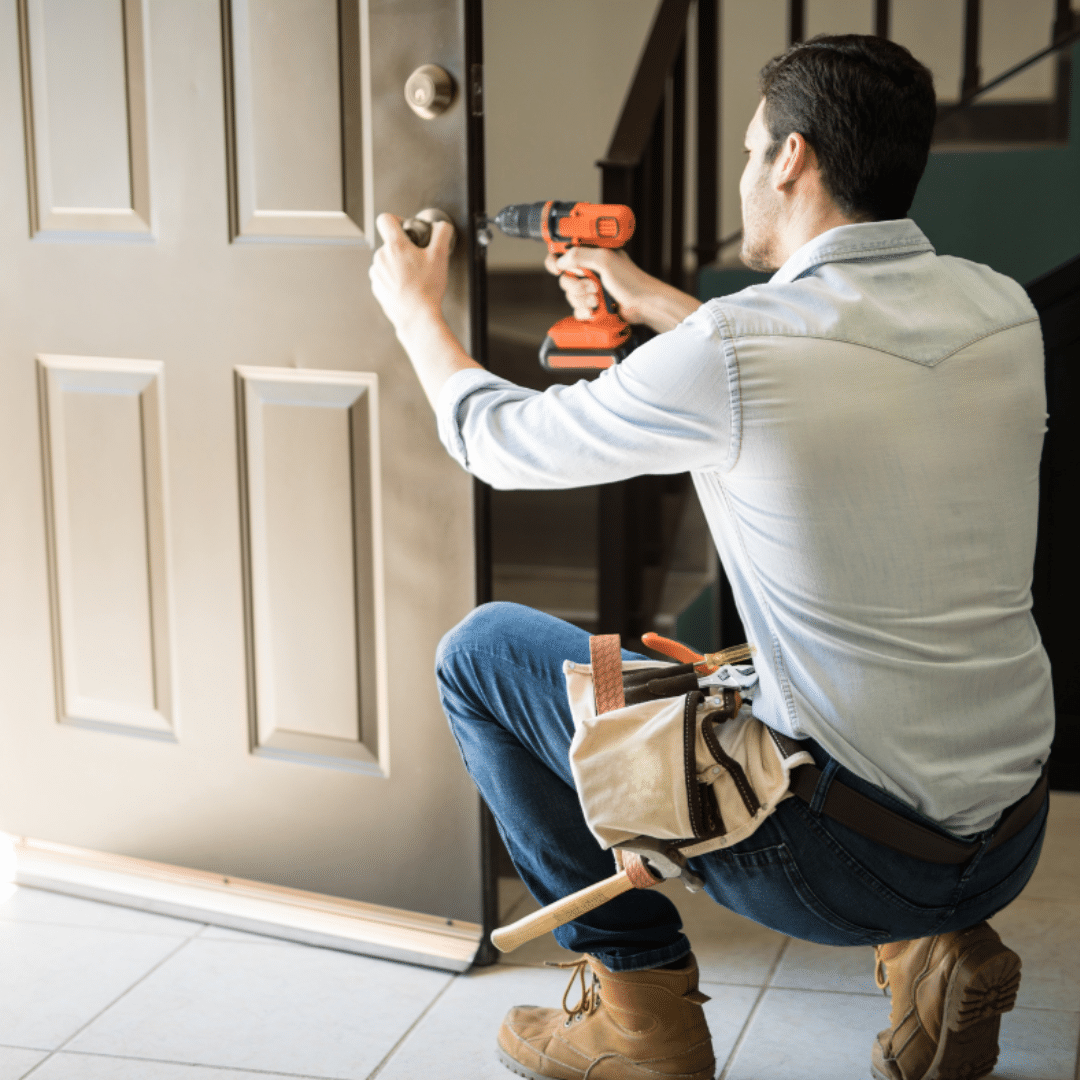 a man installing a doorknob