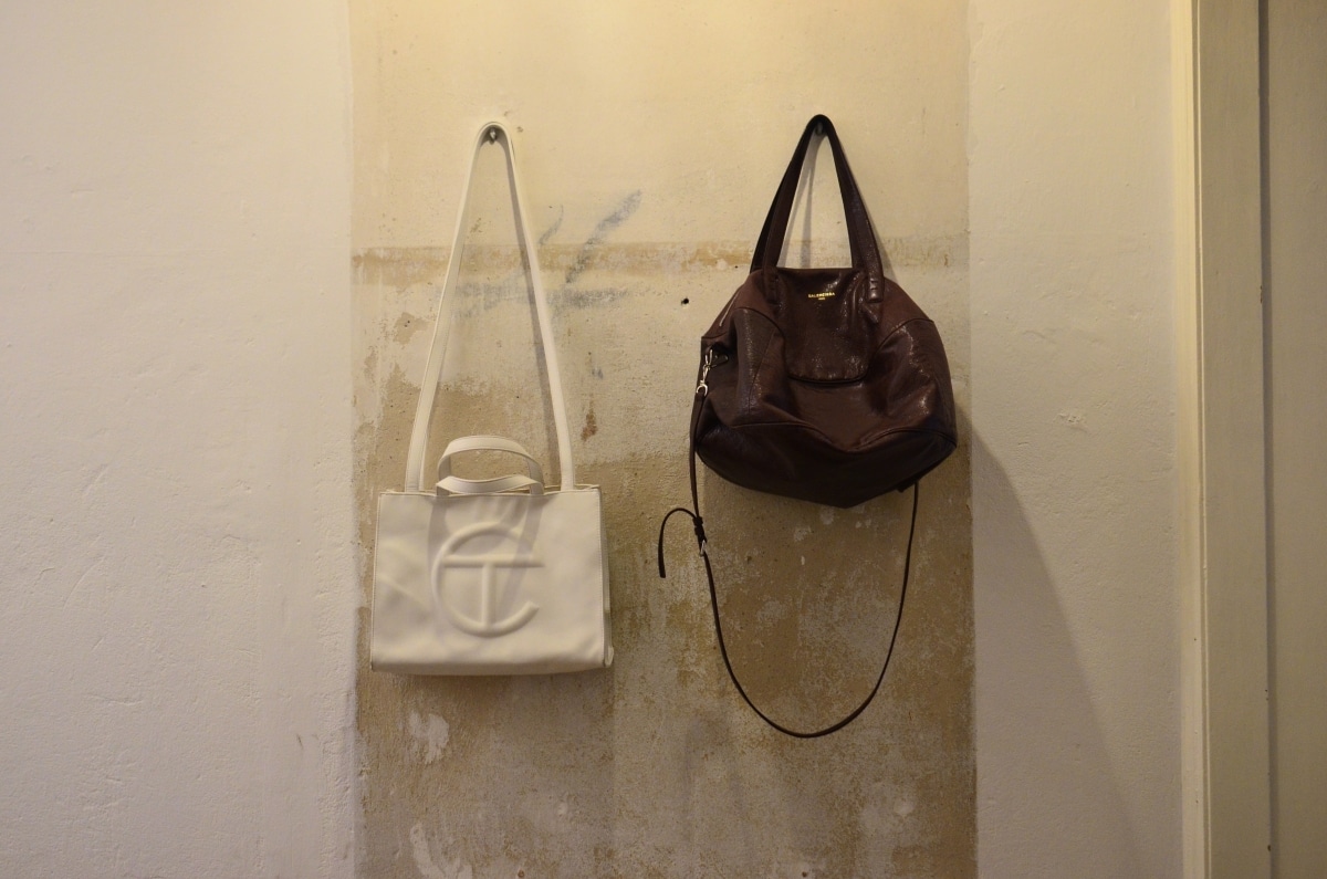bag hooks in a rustic hallway