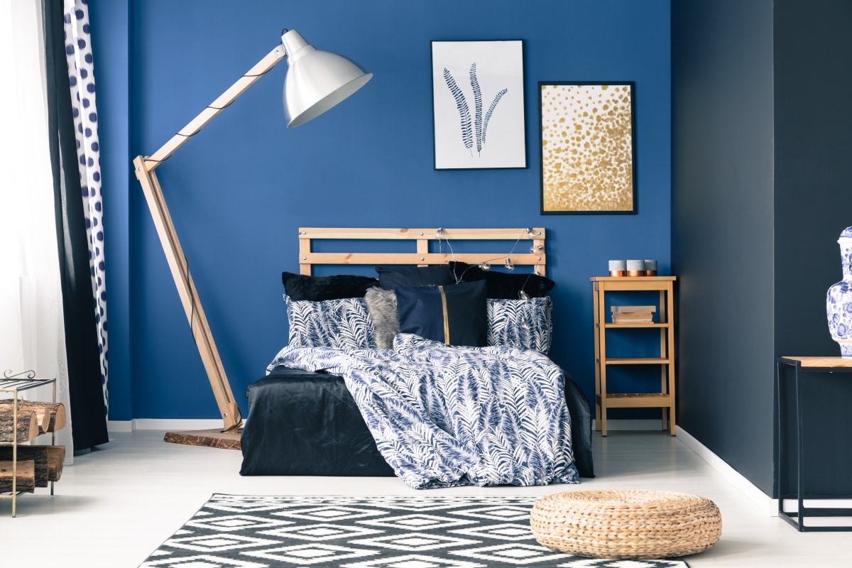 Modern bedroom in shades of blue with gold accents