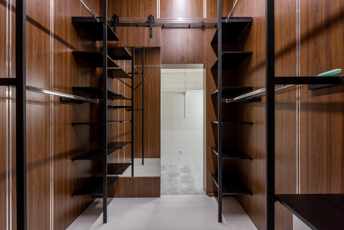 Dressing room with empty shelves and racks
