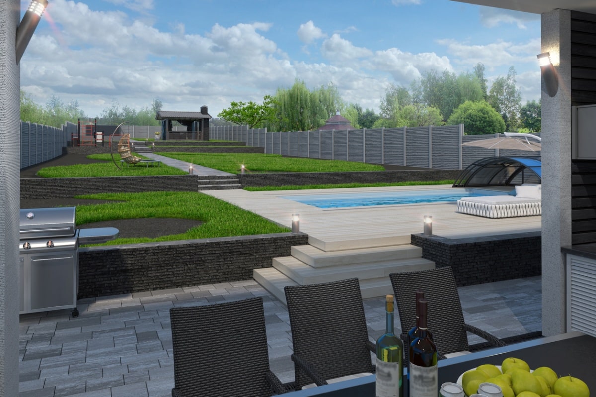 View to a terraced backyard with a pool