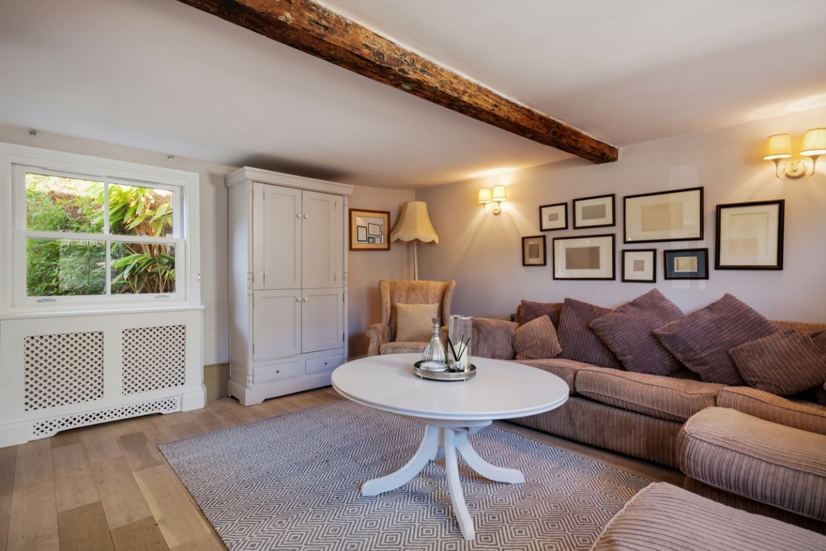 stylish cottage with large cushions and rug