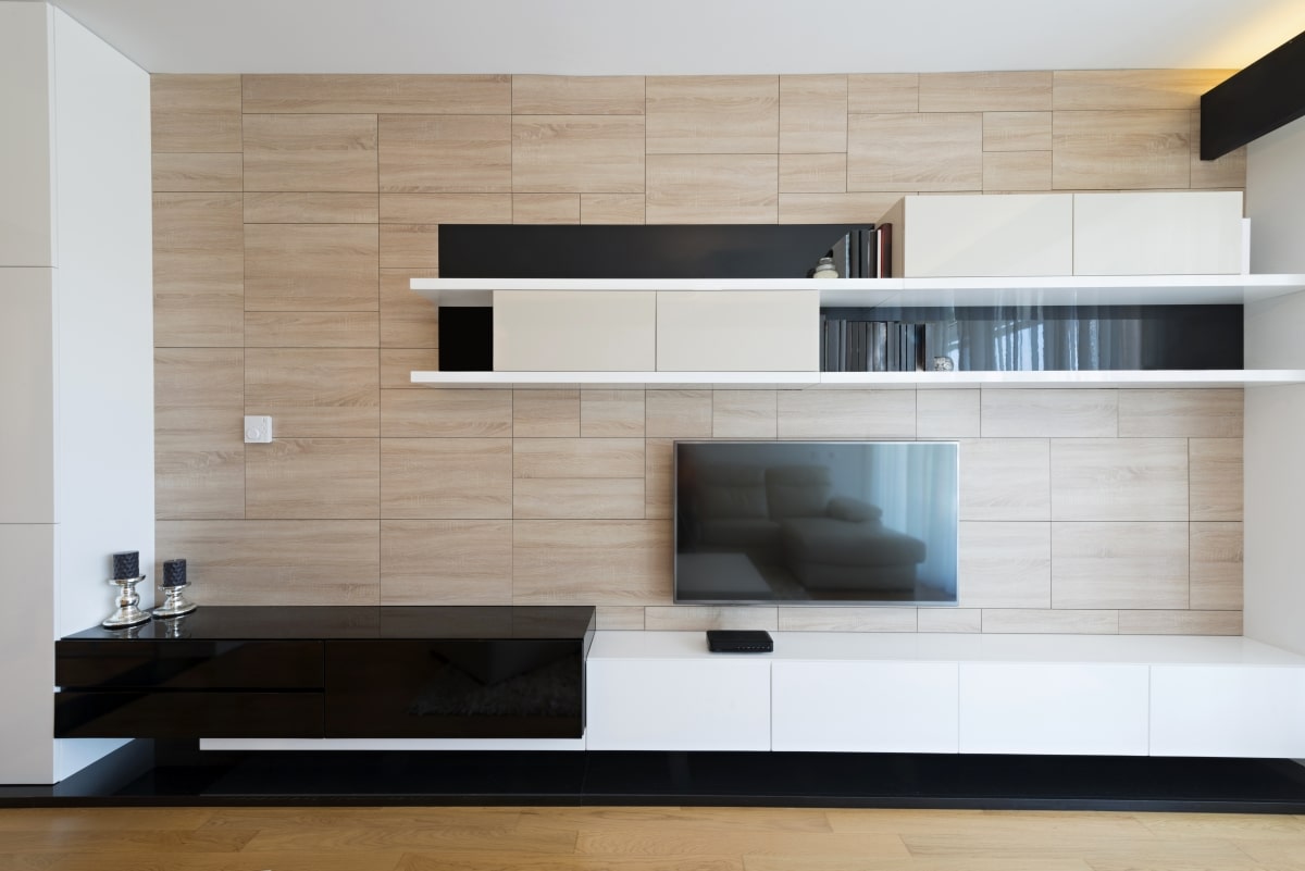 wood-paneled tv wall with two-toned console