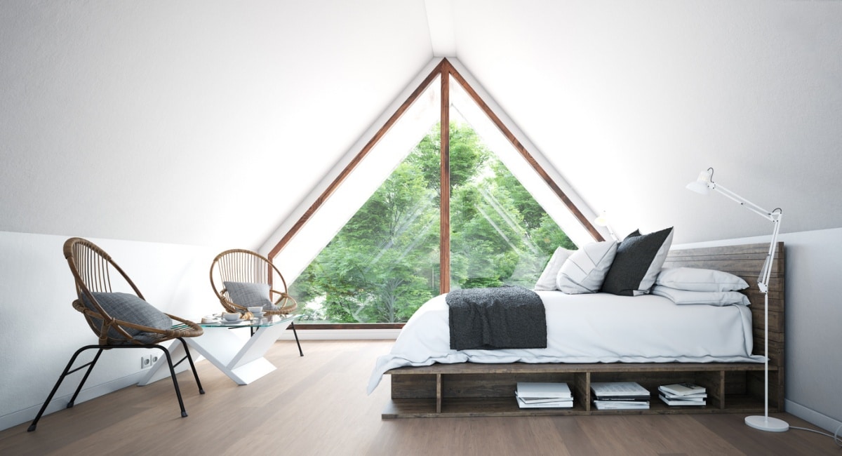 Modern attic bedroom interior with triangular window