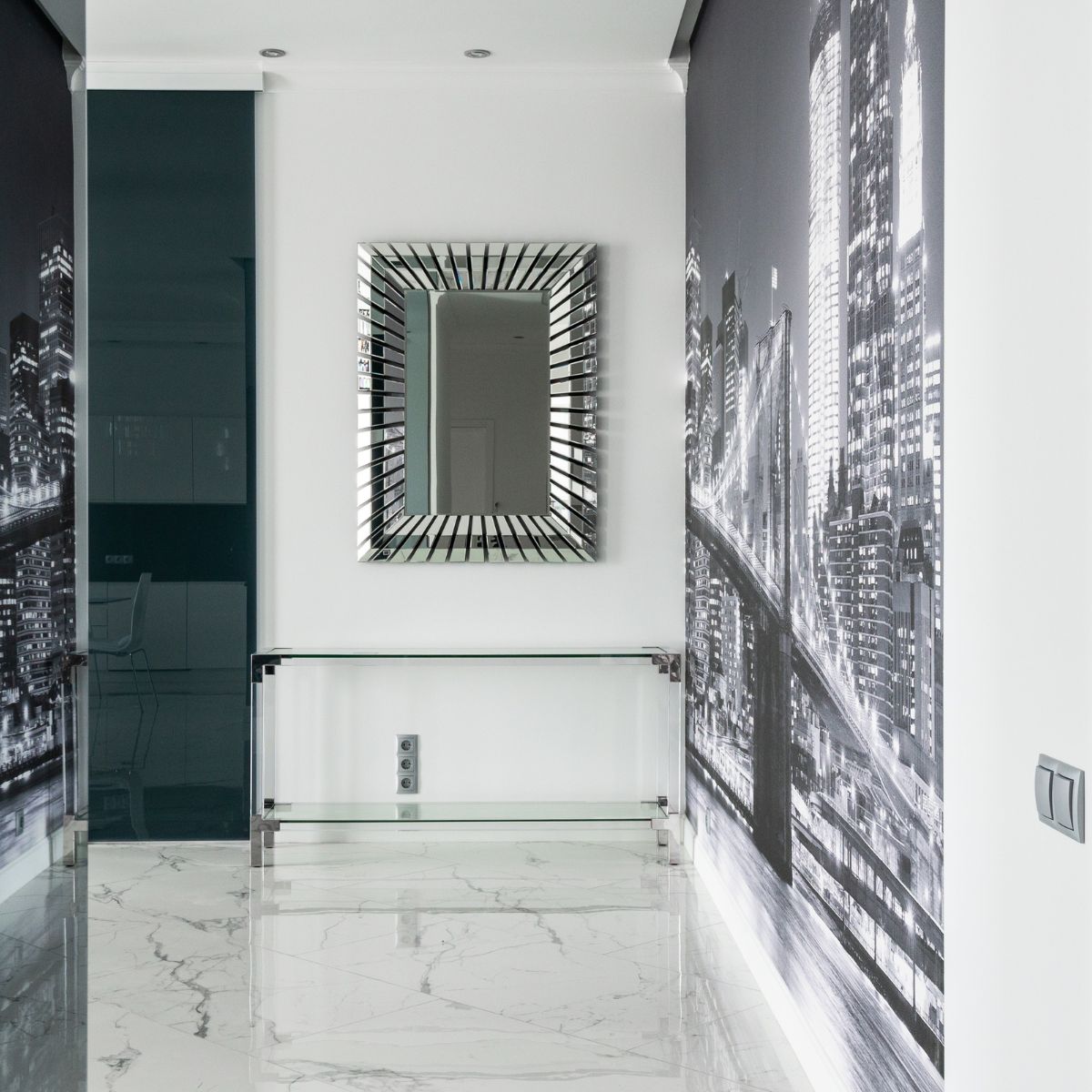 a modern hallway with a mirror and a mural