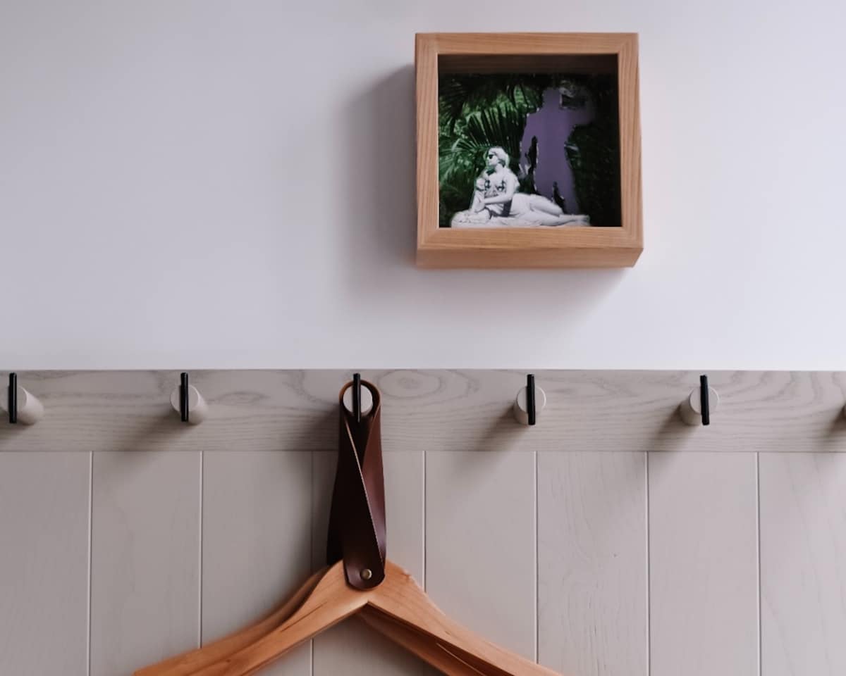 minimalist wall hooks with decorative frame