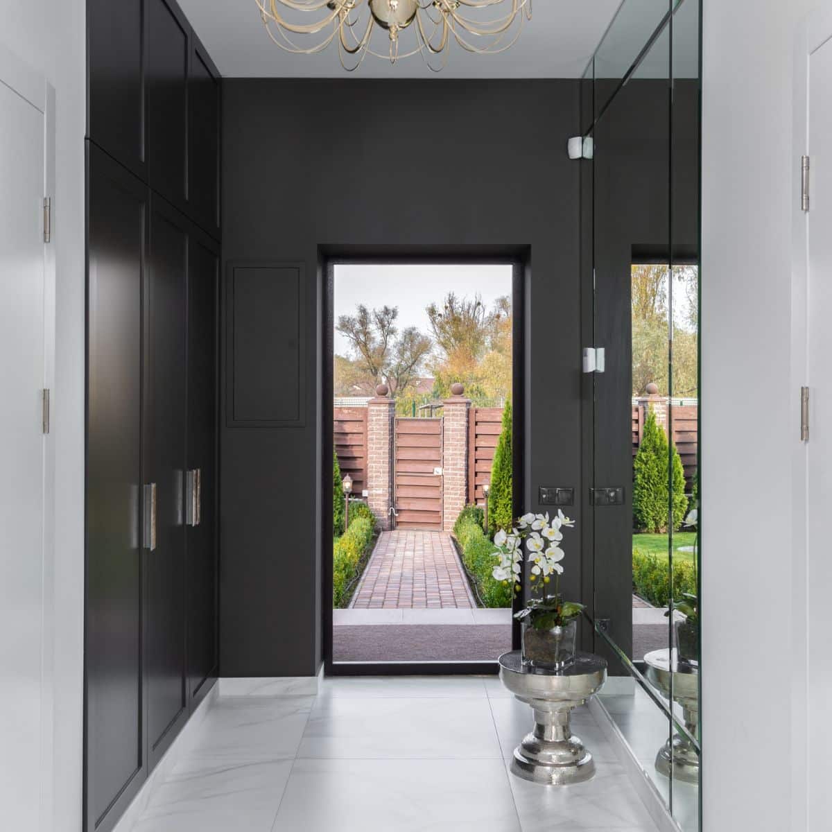 a black and white hallway with marble floors