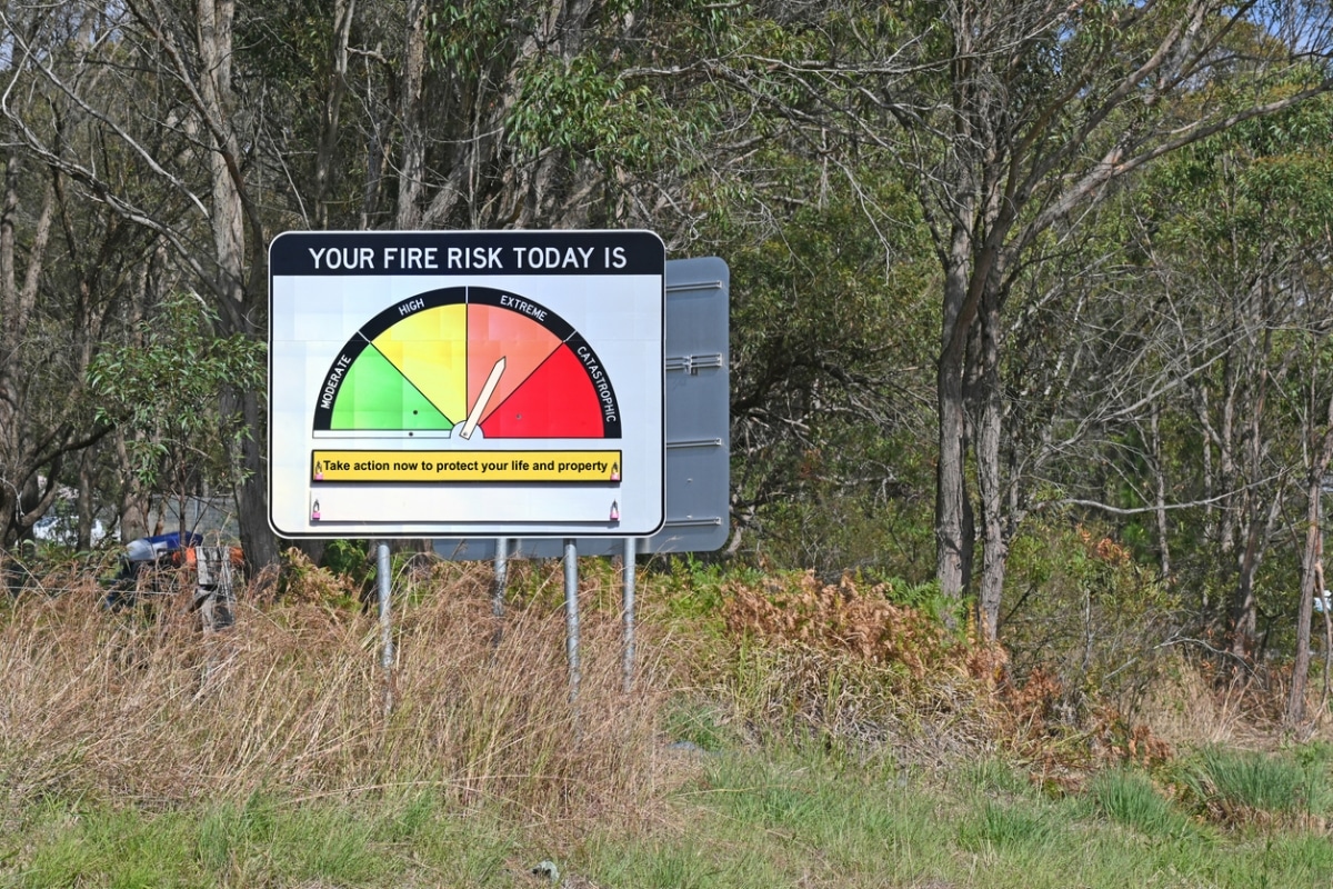 A bushfire warning sign showing extreme fire risk
