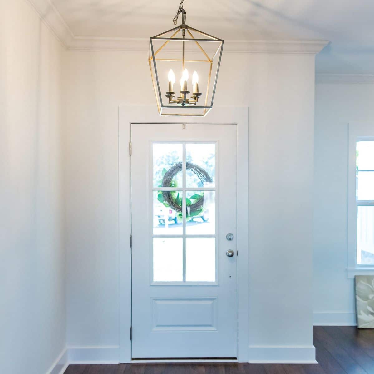 a simple chandelier in a hallway