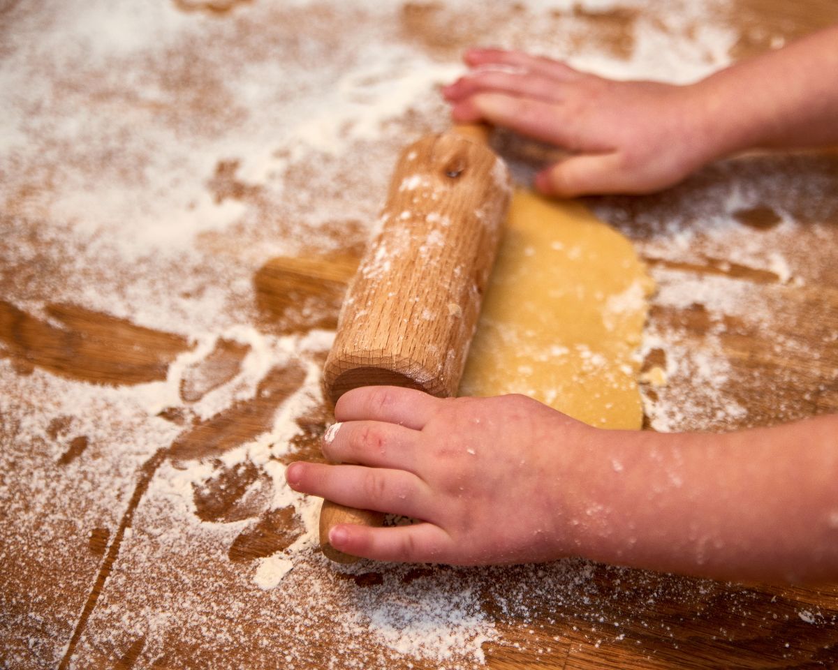 little hands using rolling pin