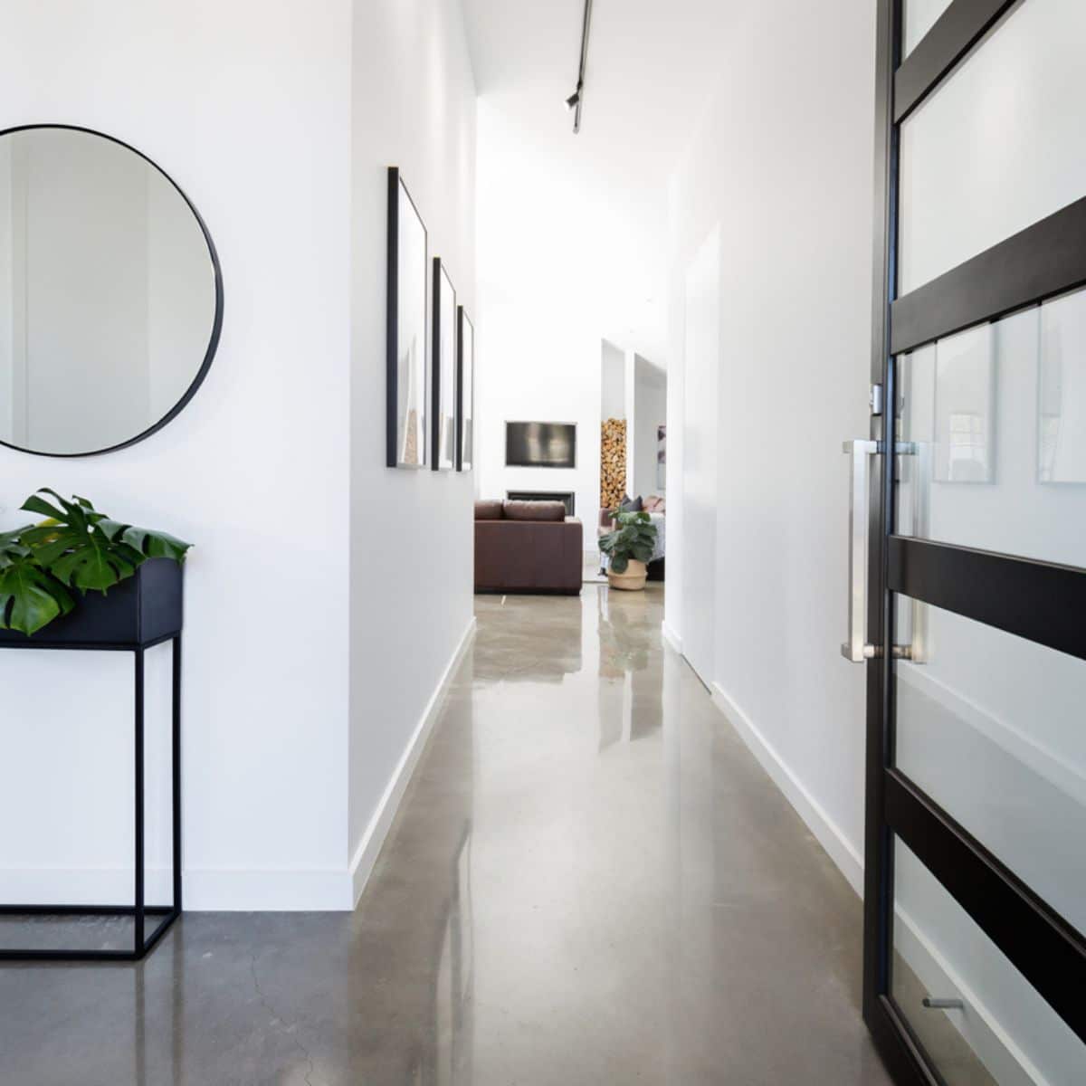 A white hallway entrance with black accent details