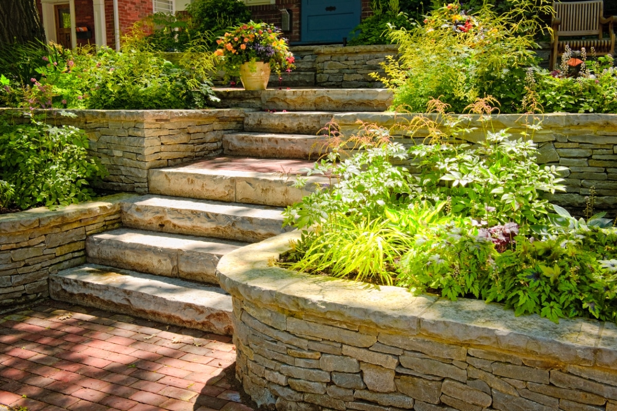 multi-level garden beds with natural stone landscaping