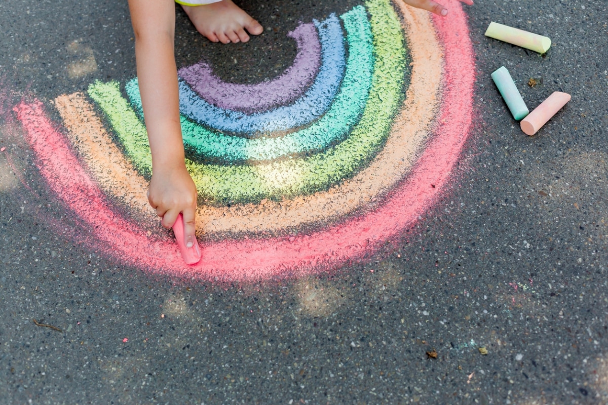 coloured rainbow drawing on pavement