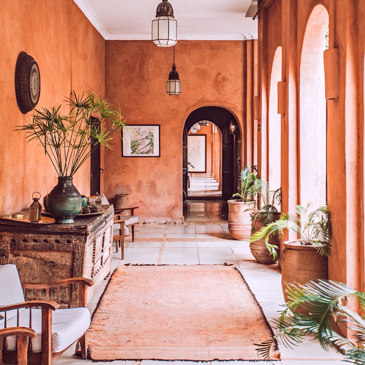a terracotta hallway with rustic furniture