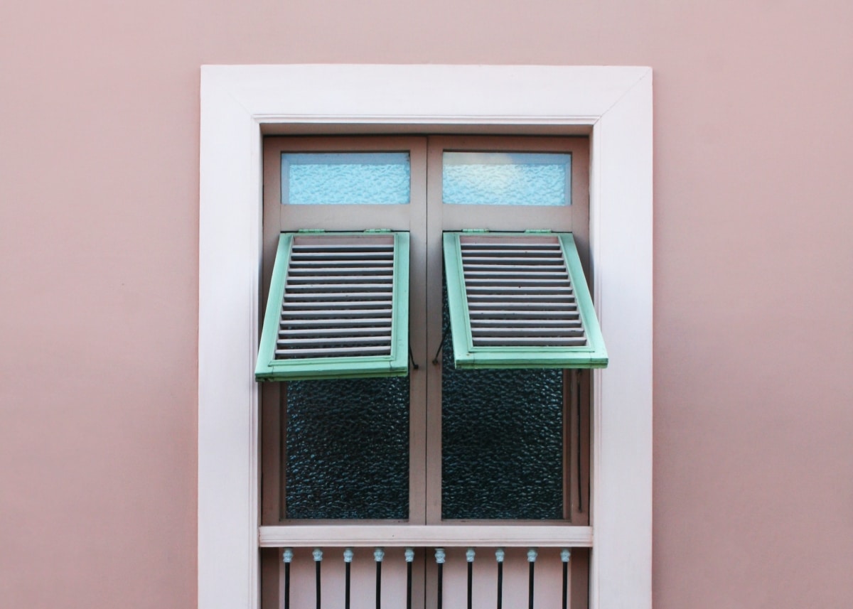 windows with colourful green awning