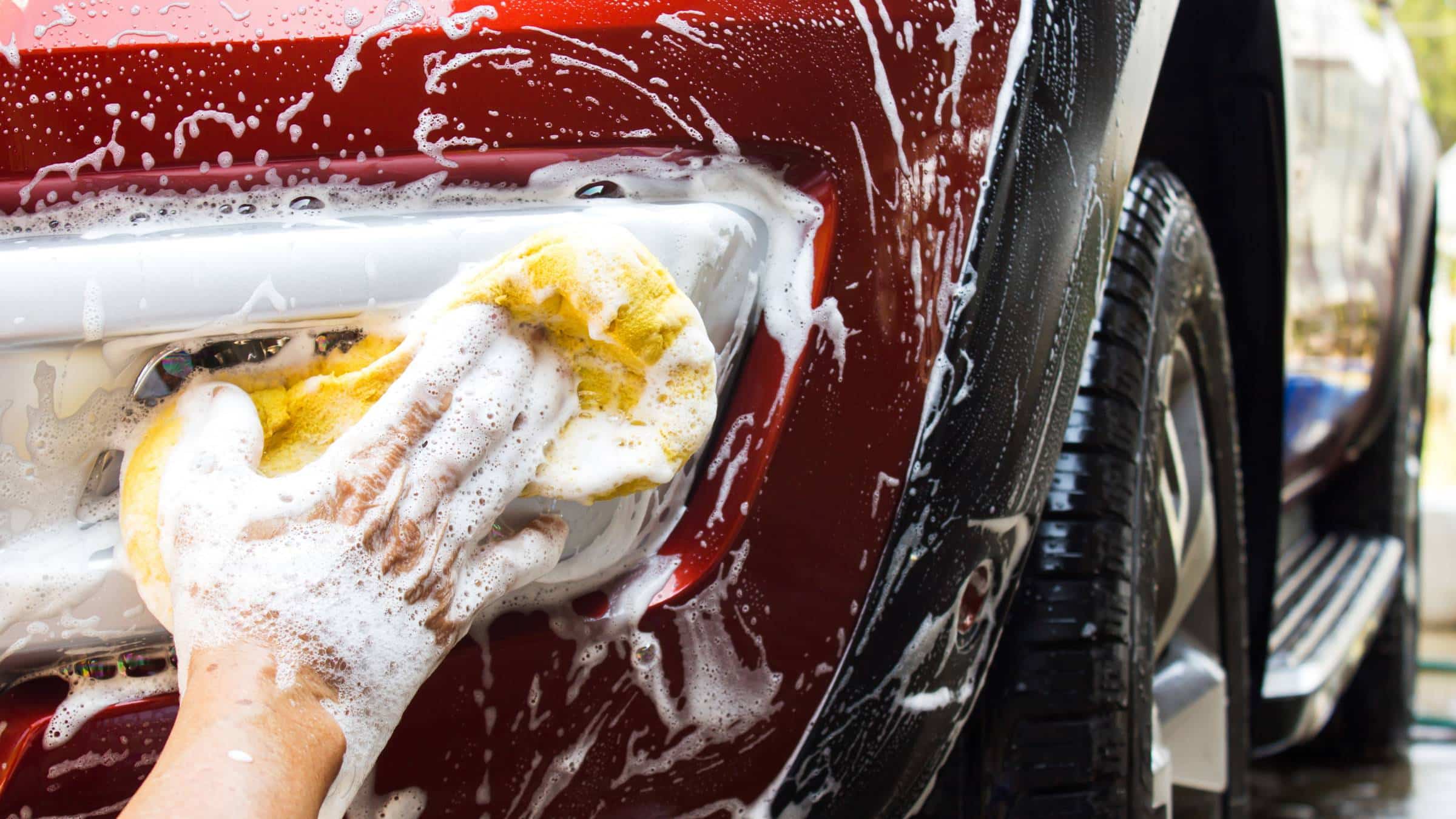 a red car getting a car wash